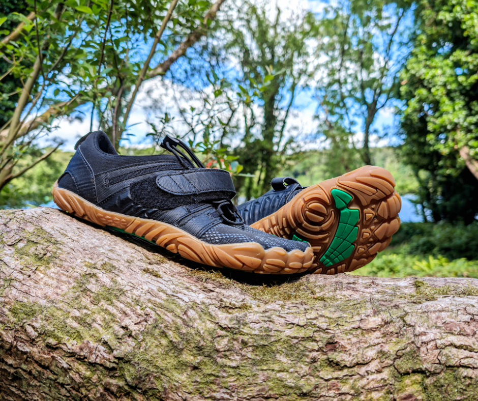 a pair of barefoot shoes in the woods