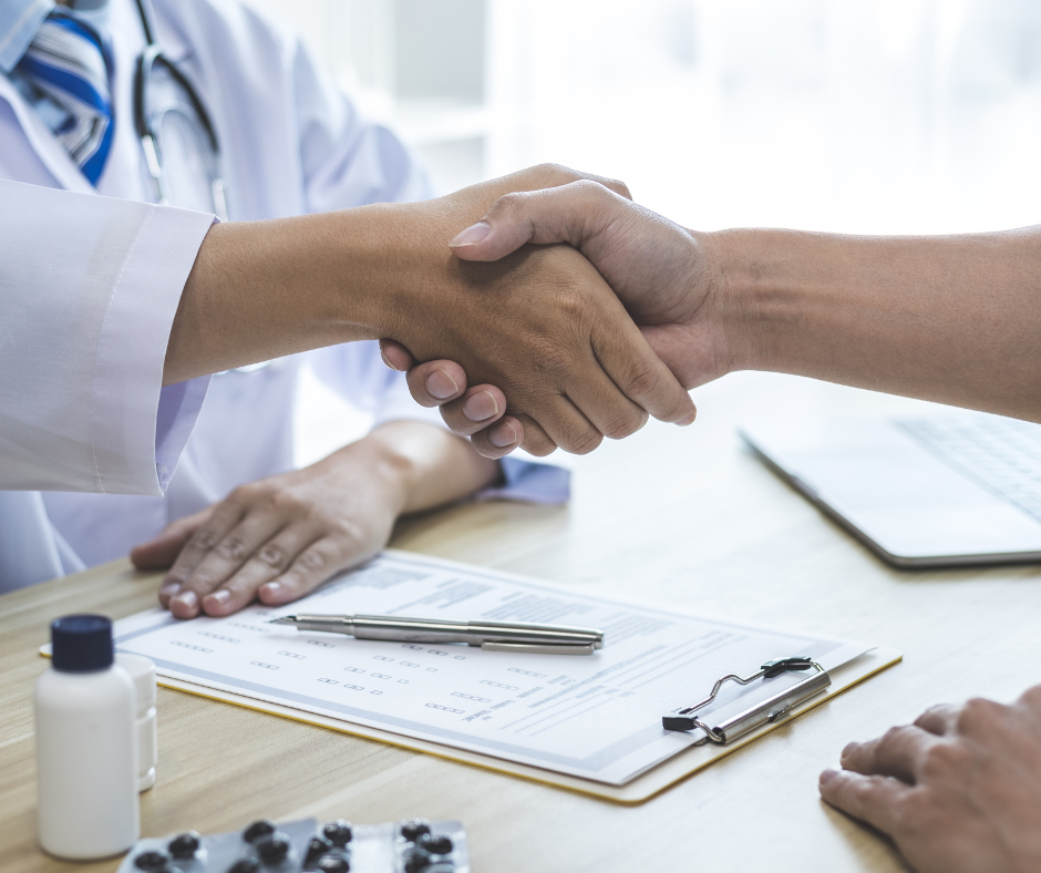 Doctor and patient shaking hands